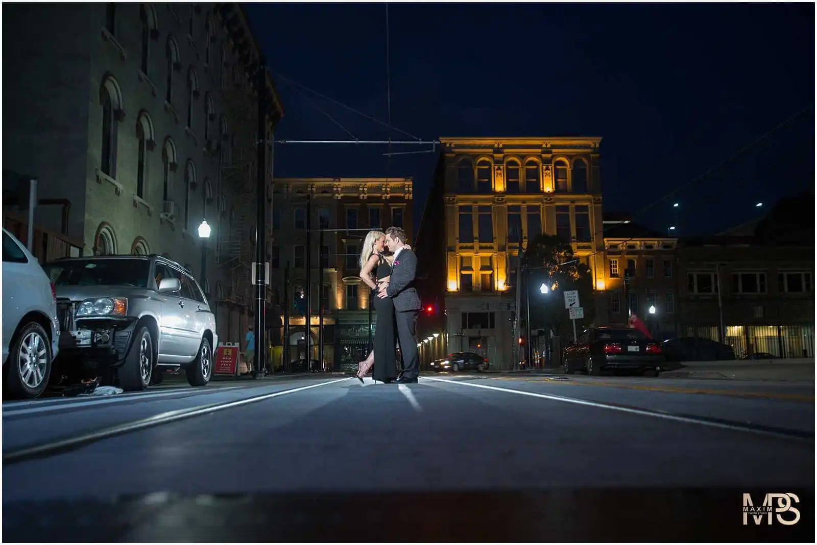 Romantic engagement photo at night in Cincinnatis OTR district.