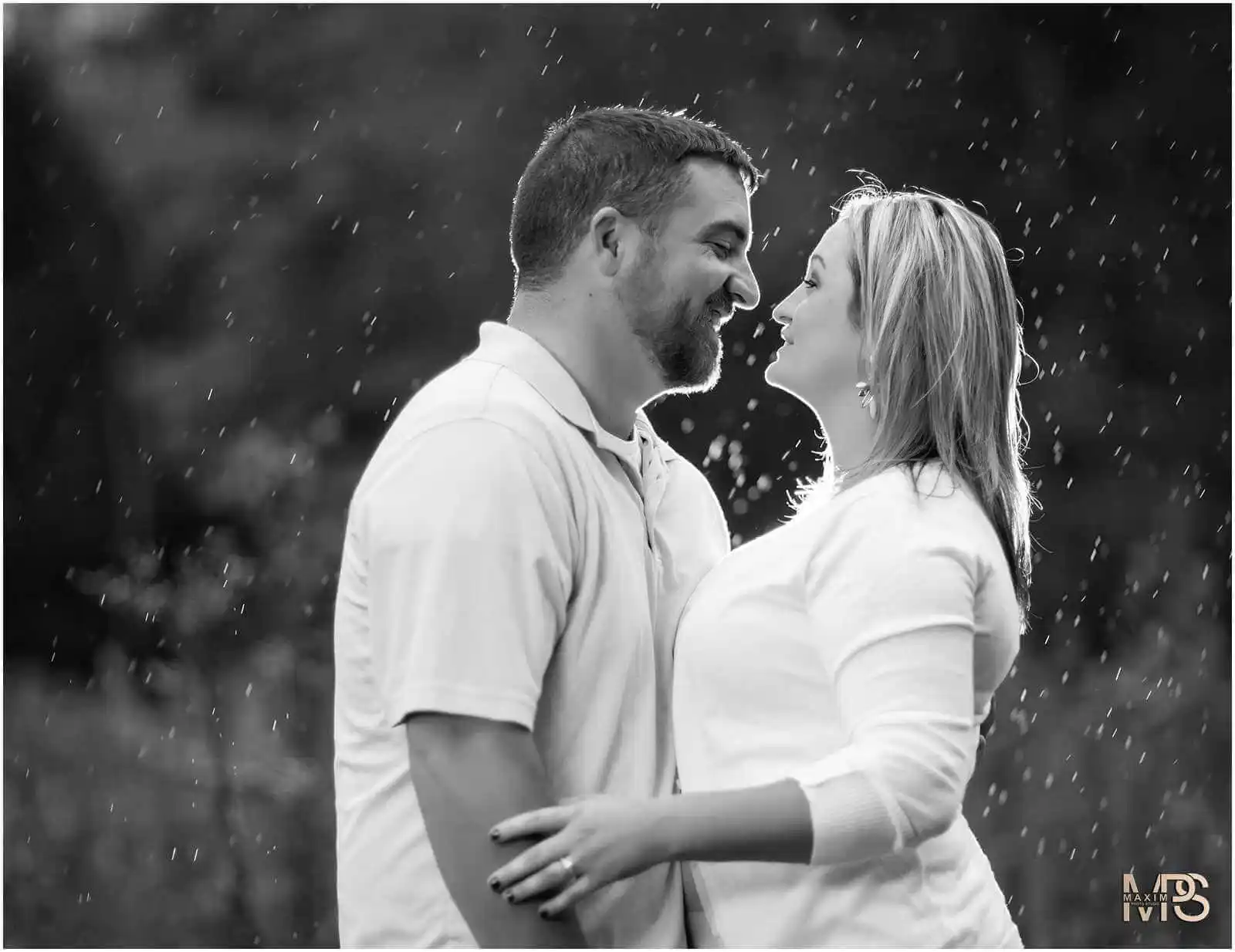 a man and woman standing in the rain at Glenwood Gardens in Cincinnati