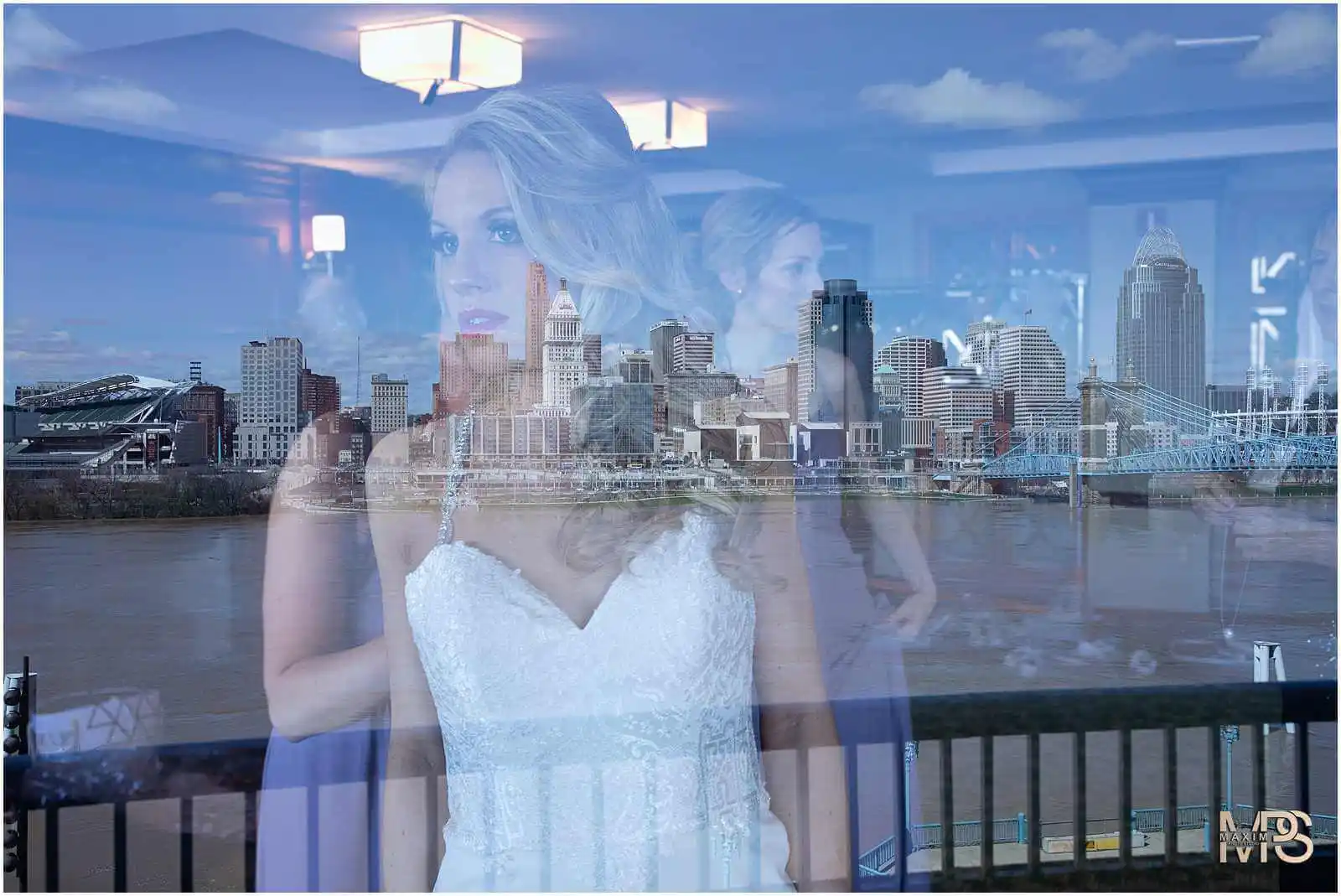 Brides reflection over urban skyline backdrop Marriott Rivercenter Covington KY