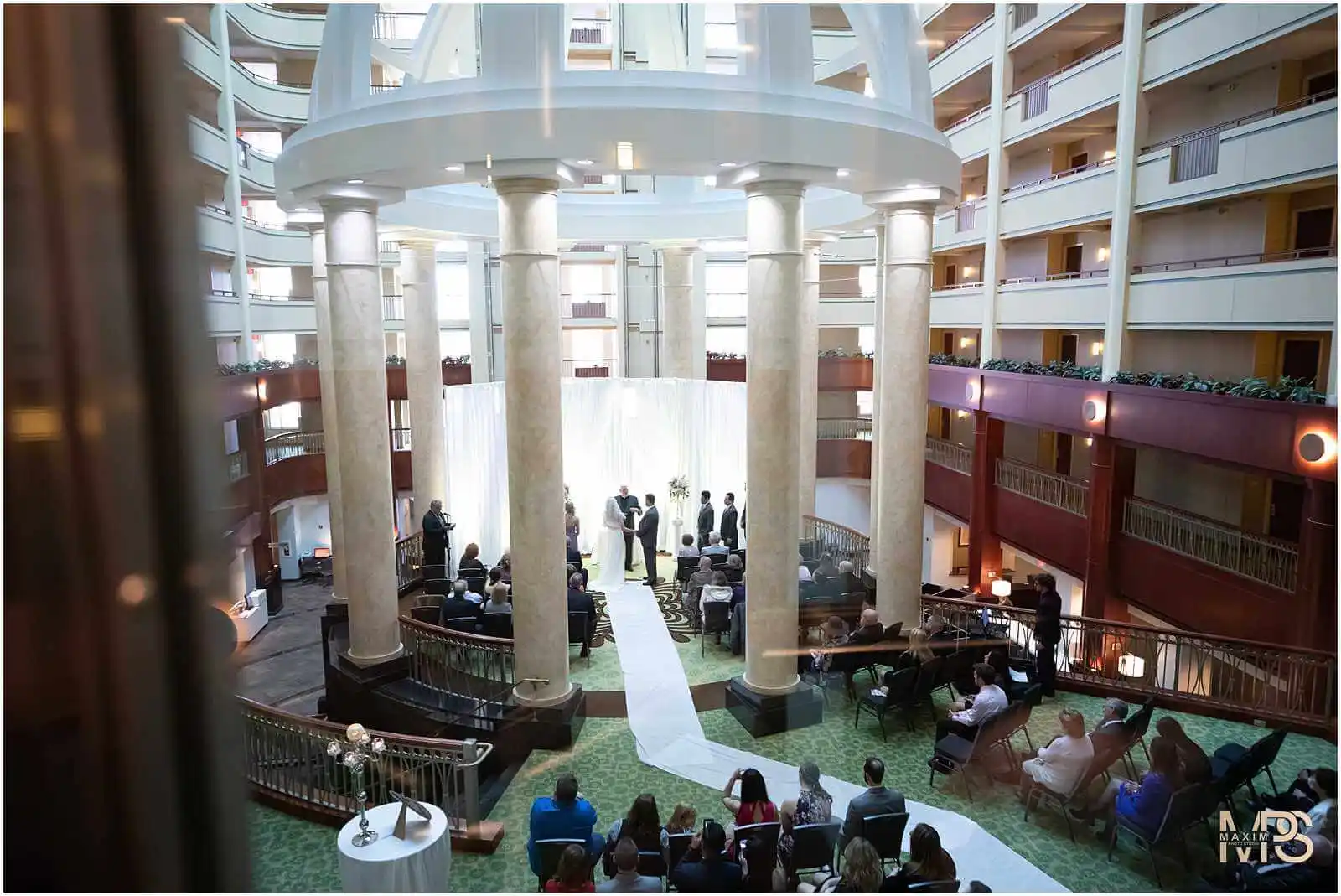 Luxurious hotel atrium hosting a beautiful wedding event  at Marriott Rivercenter Covington KY