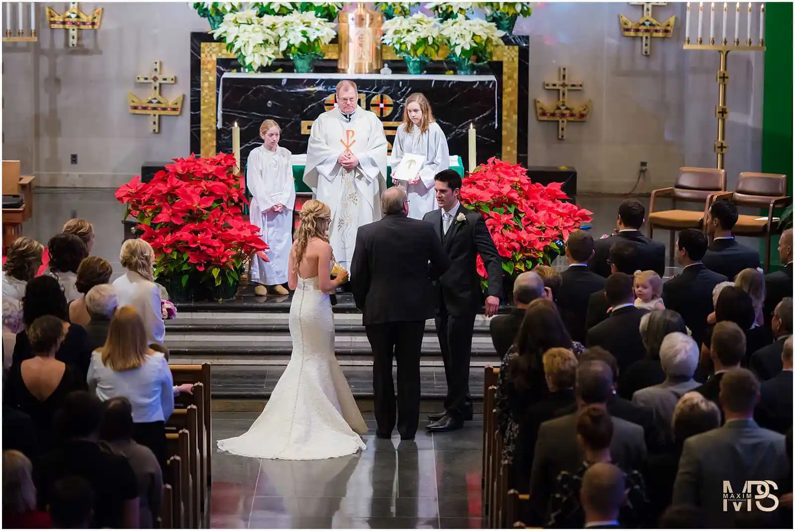 Cincinnati church wedding scene with bride, groom, and guests.