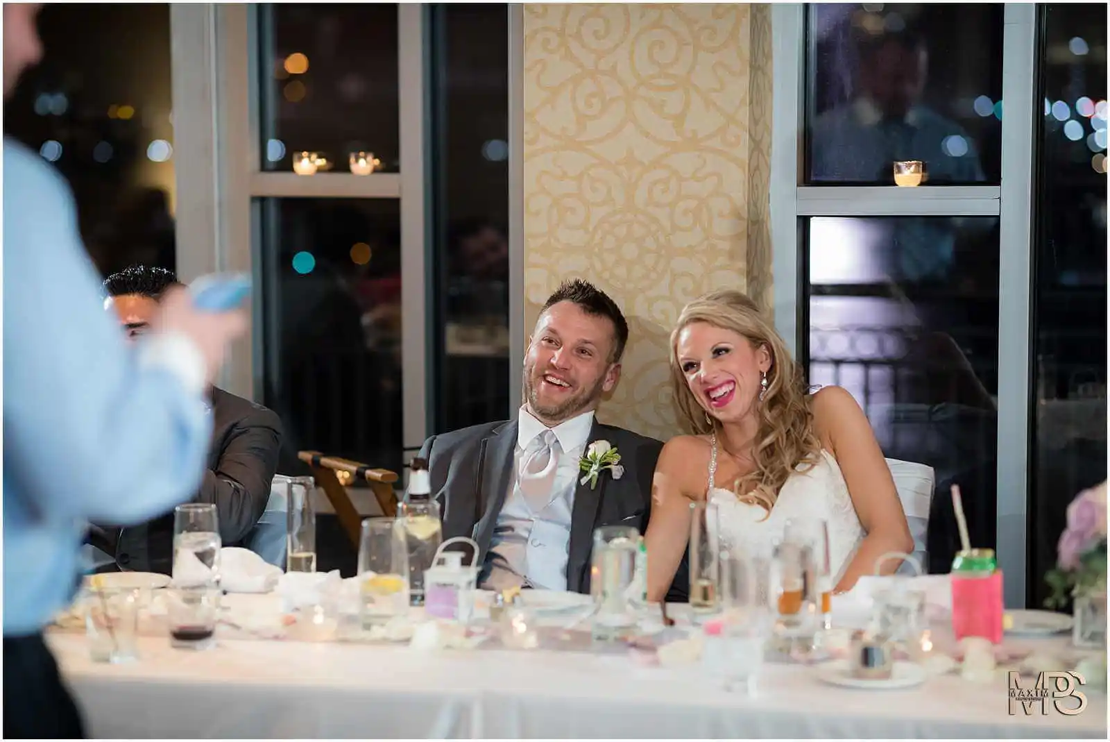 Joyful bride and groom laughing at wedding reception Marriott Rivercenter Covington KY