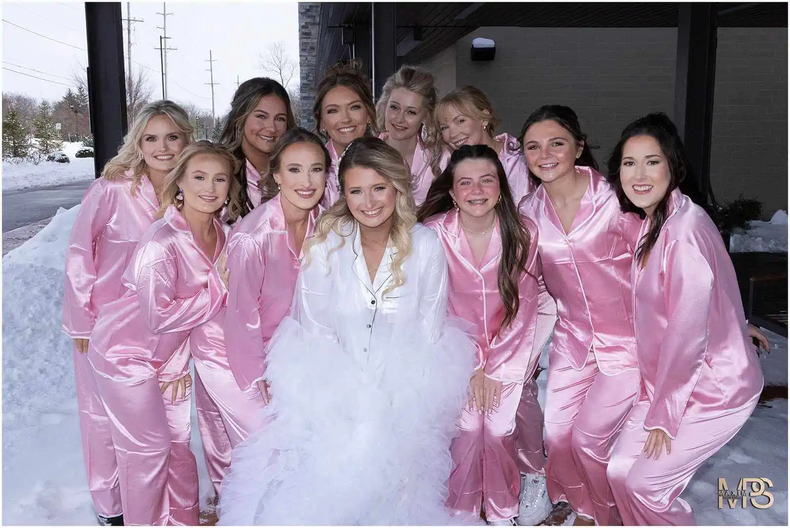 Manor House Ohio wedding bride and bridesmaids posing outside in snow