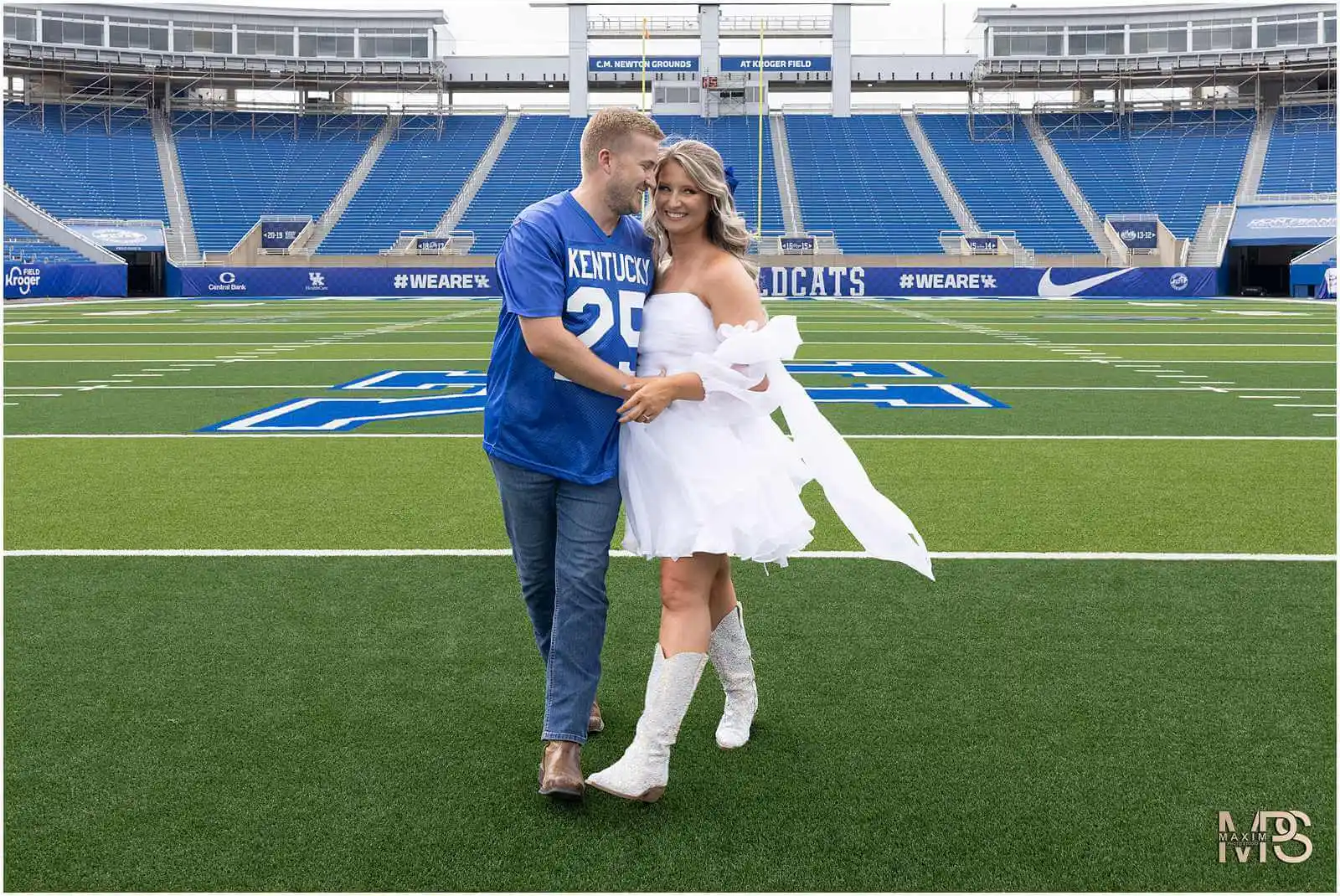 Bride and Groom walking at UK Kroger Field engagement photography session