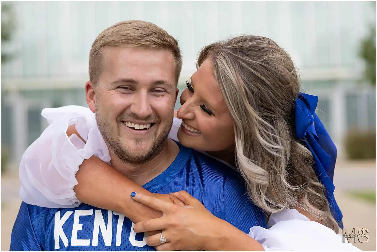 Bride and Groom sharing a laugh at UK Kroger Field engagement photography session