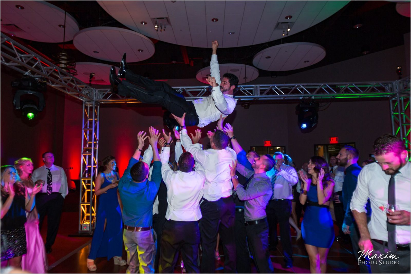 Cincinnati Wedding Photographers Sharonville Convention Center Wedding Reception Groom toss