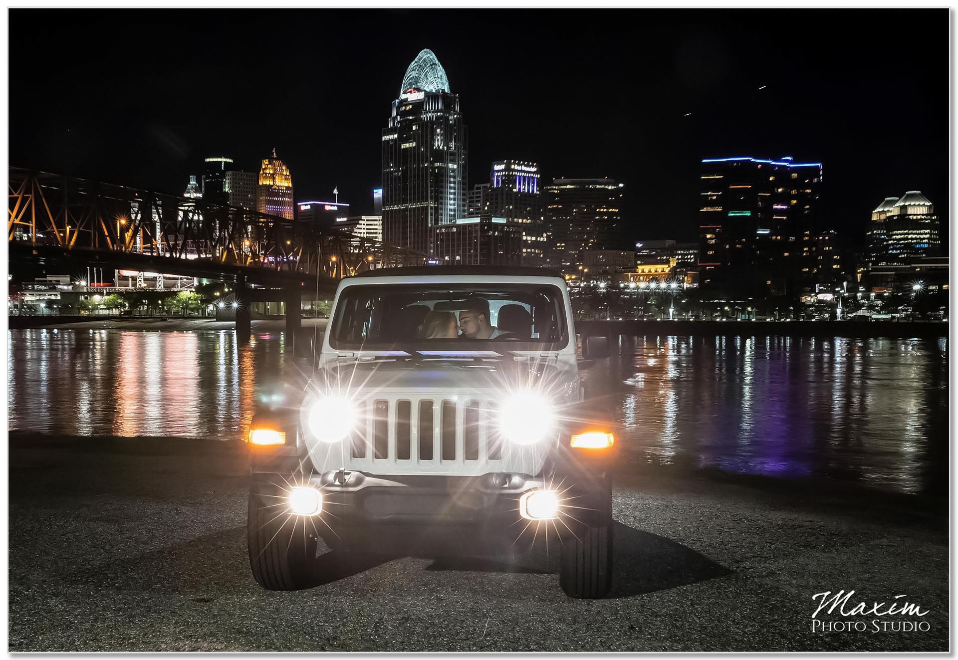 Downtown Cincinnati engagement at night Jeep Wrangler