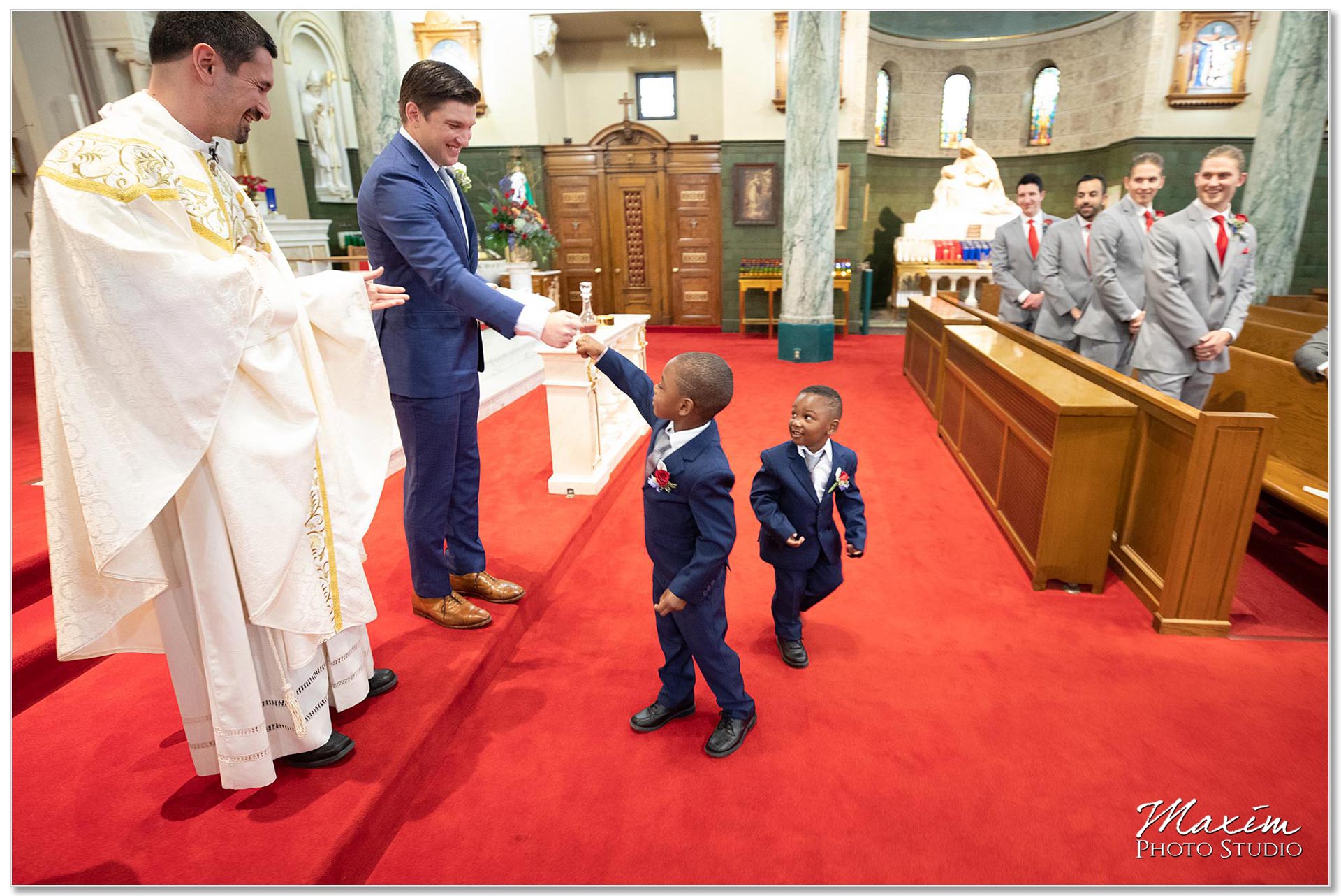 Fist pump from the ring bearers during wedding ceremony