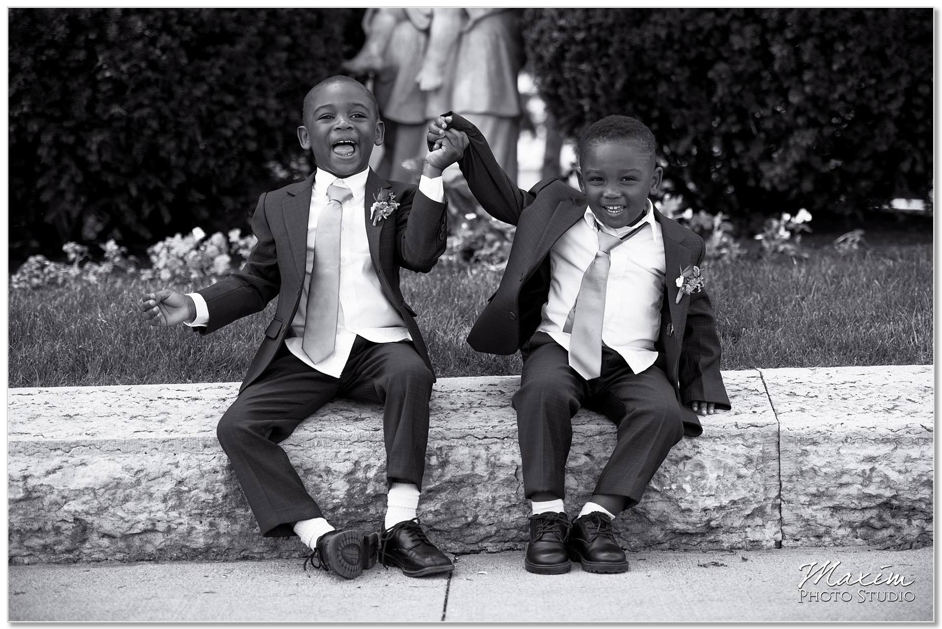 Ringbearers having wedding day fun