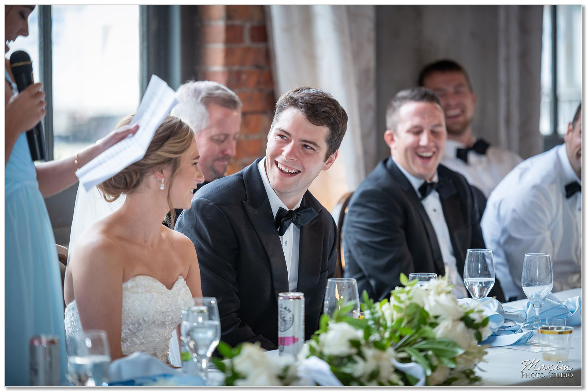 bride groom laughing at The Steam Plant wedding reception