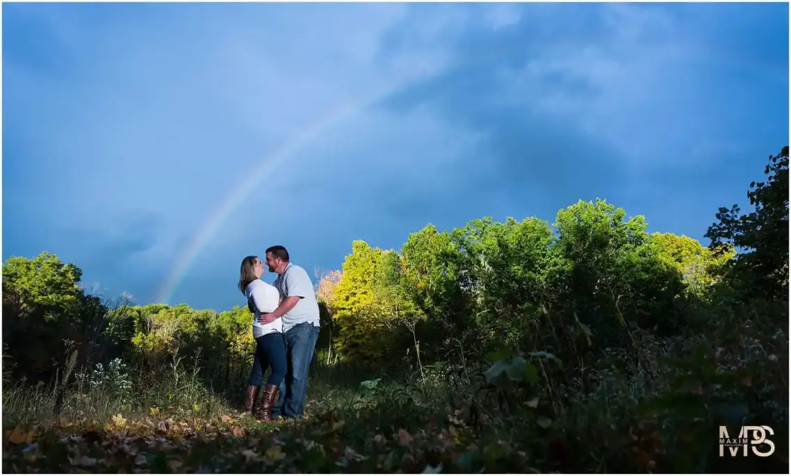 a man and woman kissing in a forest Cincinnati Nature Center